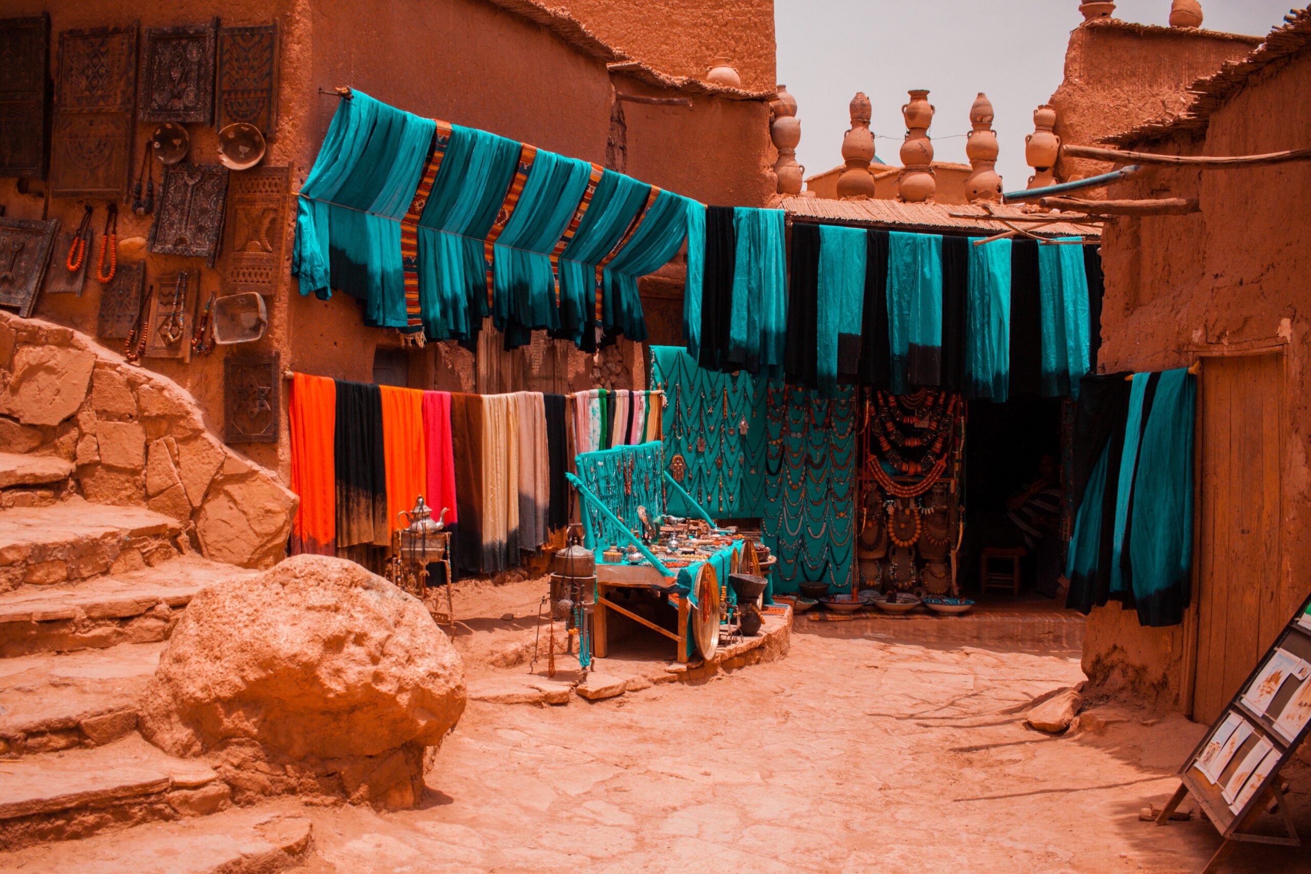 Colourful fabrics in morocco against earthy tones