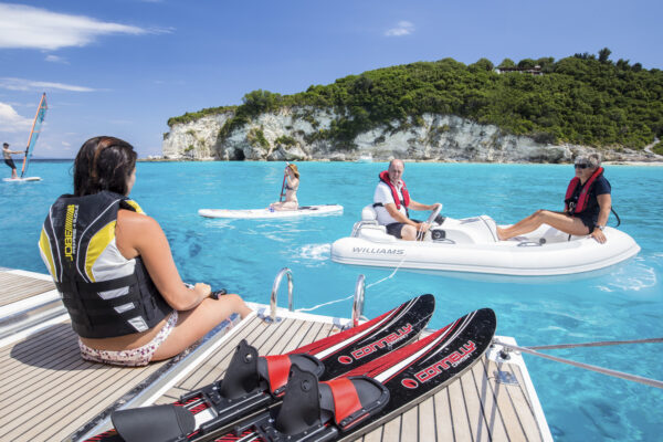 wearing a lifejacket doing watersports while sailing in greece
