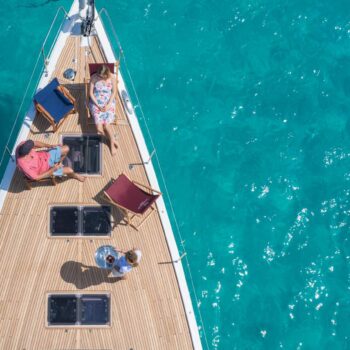relaxing on the bow of a luxury yacht