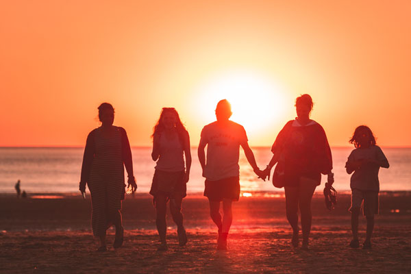 Family walking in the sunset