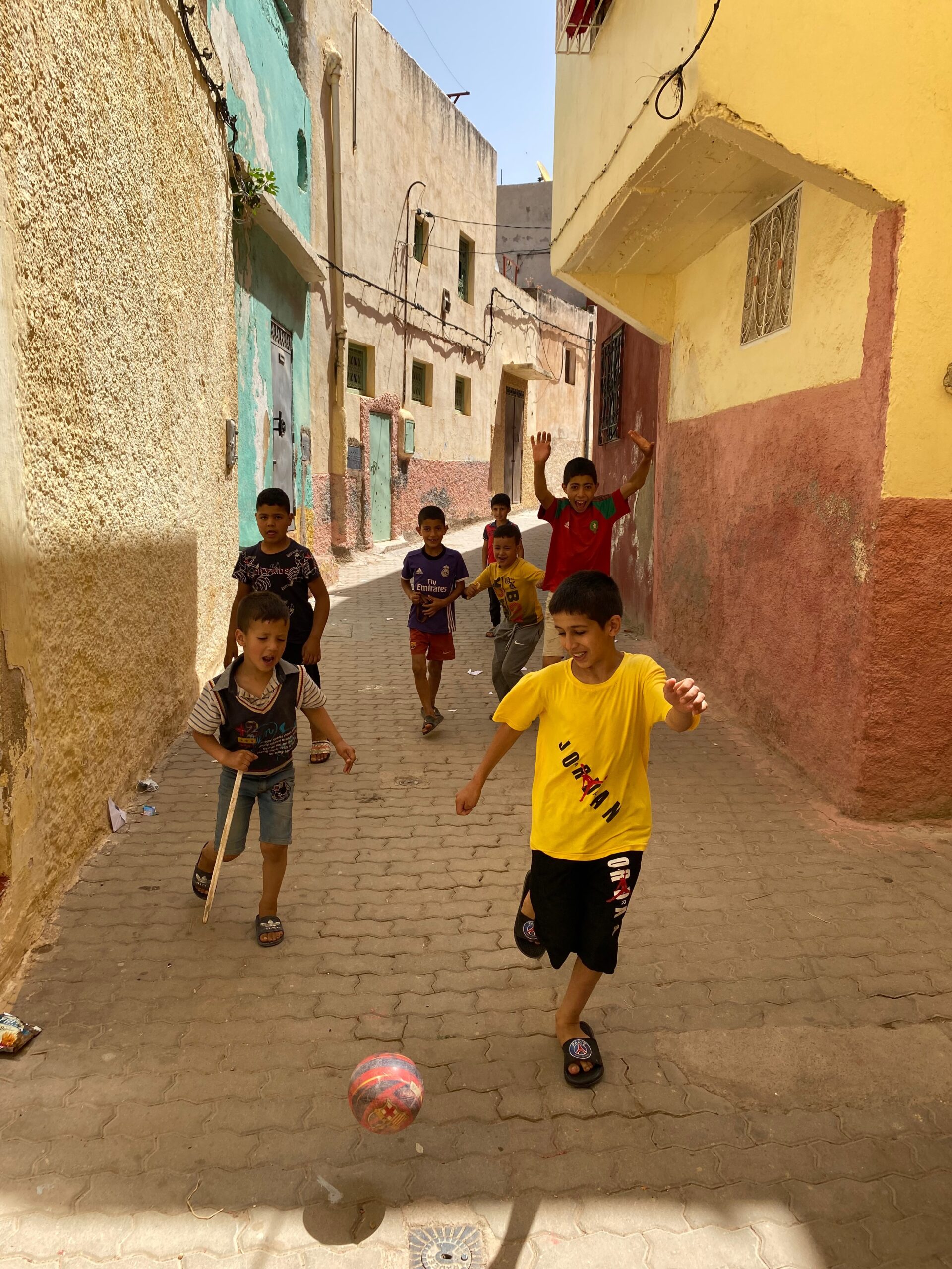 Boys play football in Bhalil