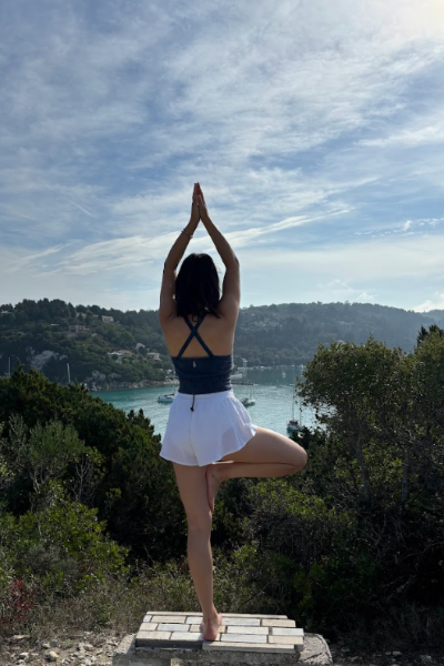 Emily Fresson practising yoga as part of Fleewinter's Weekend Wellness Retreat onboard Aurous.