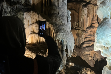 Guest taking a photo in the Postojna Cave